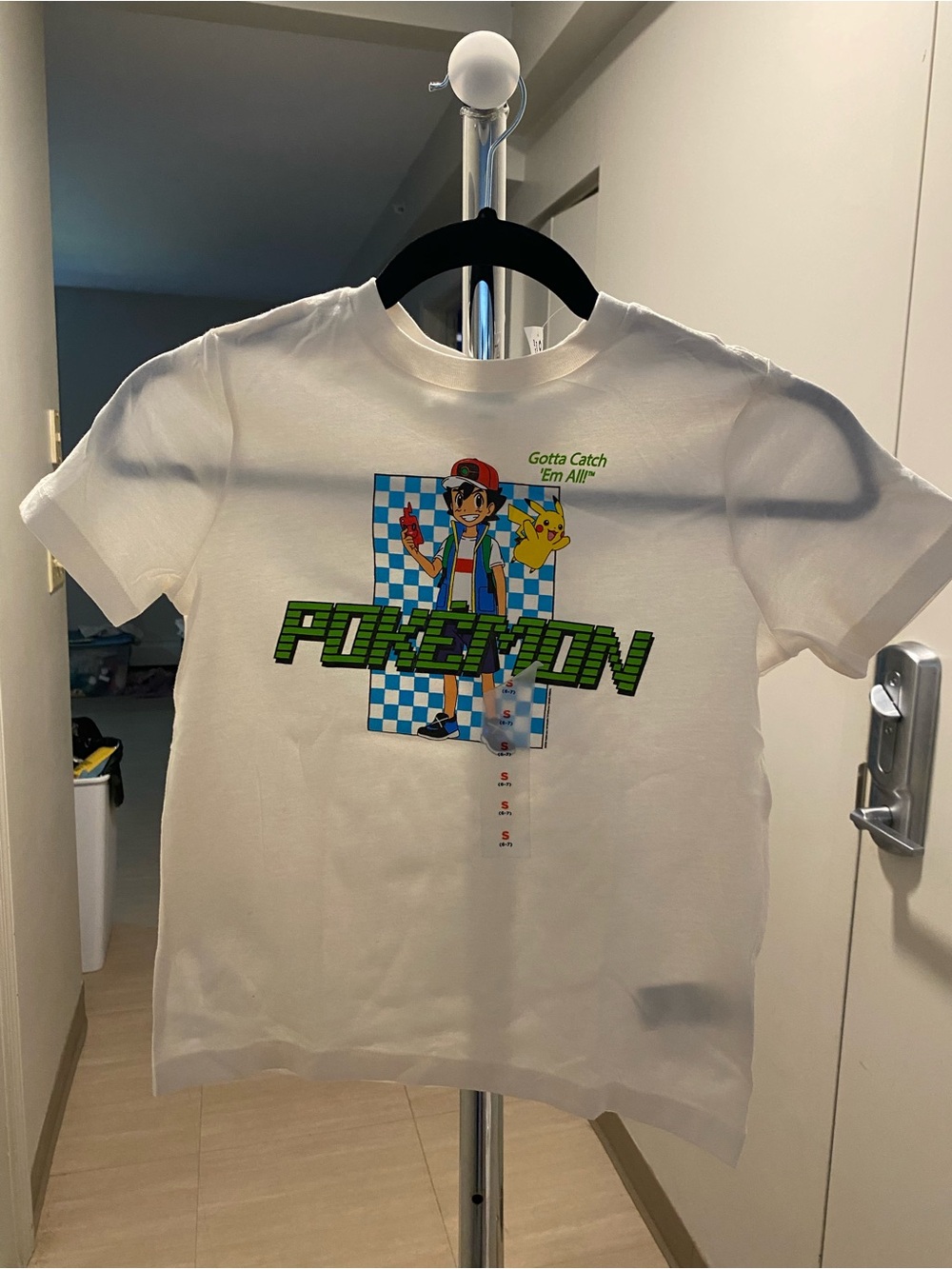 Pokemon White Kids Tee with Green Logo and Blue Check Graphic